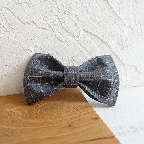Luxury bowtie dog collar by Dog Hugs Cat featuring stylish polyester fabric and a decorative bow for fashionable pet accessories.