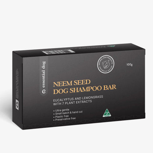 Solid dog shampoo bar with neem seed, lemongrass, and eucalyptus from Essential Dog, shown in its packaging.