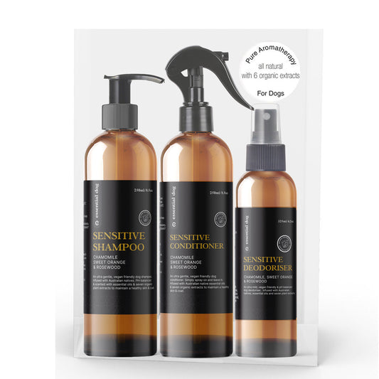Essential Dog sensitive deodorizing wash with chamomile, sweet orange, and rosewood for dogs, showing the bottle and natural ingredients.