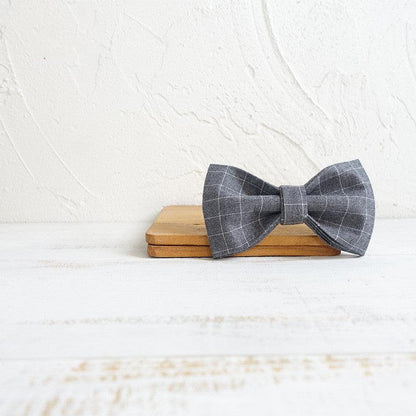 Luxury bowtie dog collar from Dog Hugs Cat, stylish polyester accessory with adjustable strap for small to medium dogs.
