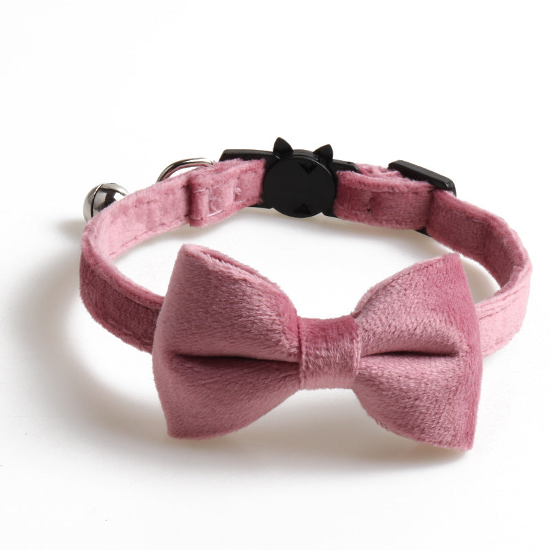 Velvet dog collar with bowknot detail from Cashymart, featuring soft fabric and adjustable strap for a stylish pet accessory.