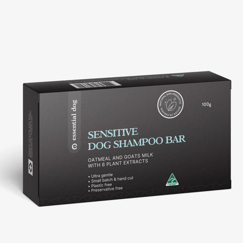 Solid dog shampoo bar for sensitive skin by Essential Dog with oatmeal, lavender, and geranium, shown in a natural setting.