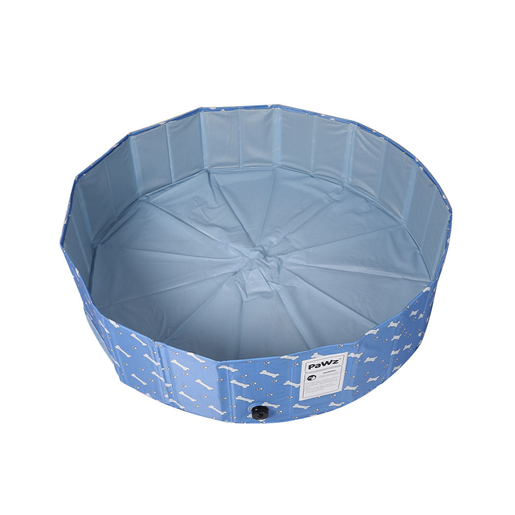 Foldable dog swimming pool by IDropship, portable pet paddling pool for dogs, with a blue foldable design and water inside.