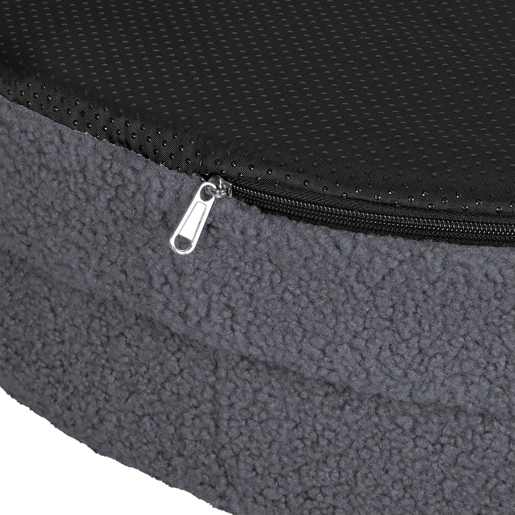 Orthopaedic memory foam dog bed with waterproof sherpa cover, calming and soft, designed for comfort and support.