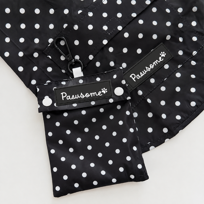 Polka dot waterproof dog raincoat with hood and pouch by Pawsome Pet Store, shown in a vibrant polka dot pattern.